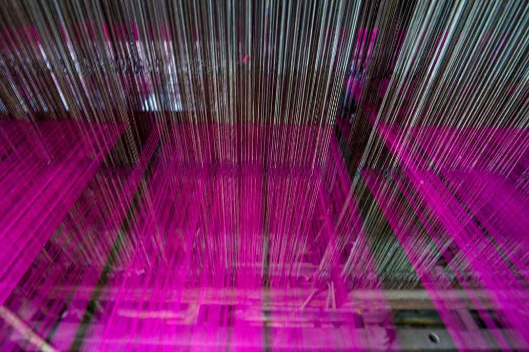 Natarajan often works with this type of power loom, which is much faster than producing woven cloth by hand.